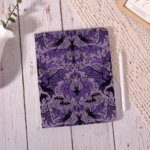 May include: A set of three ceramic mugs with a speckled, matte finish. The mugs are in shades of cream, light gray, and dark gray. Each mug has a simple, minimalist design, perfect for coffee or tea.