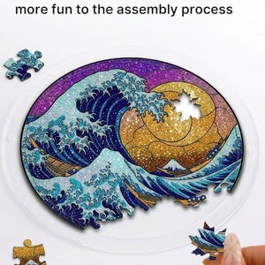 May include: A circular jigsaw puzzle depicting a stylized ocean wave design with a golden sun and a mountain. The puzzle has irregular-shaped pieces. The text "Irregular-shaped pieces add more fun to the assembly process" is visible.
