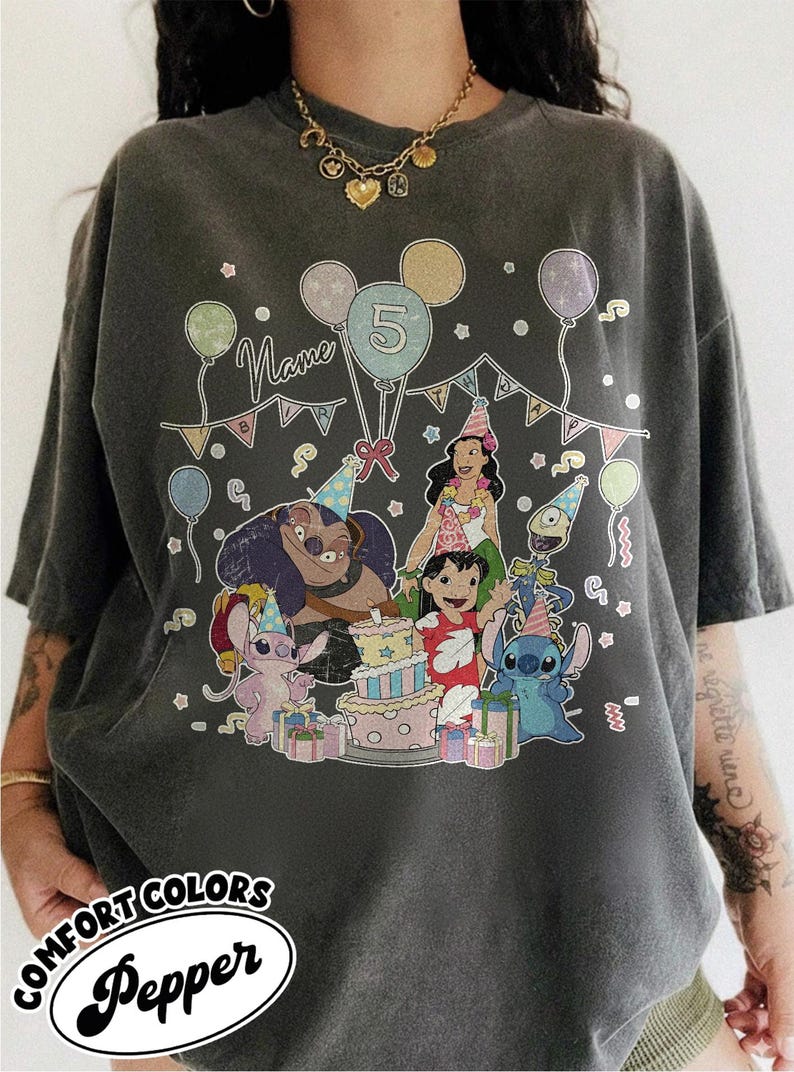 May include: Dark gray Comfort Colors t-shirt with a colorful graphic of characters from a popular animated movie celebrating a birthday. The design includes balloons, a cake, and the number 5. The word "Name" is also visible.