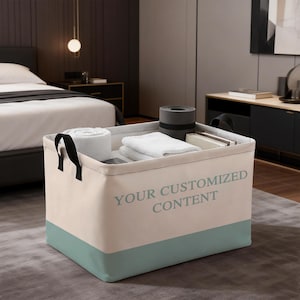 May include: A rectangular storage bin with black handles, filled with white towels and other items. The bin is beige with a teal-colored bottom and the text "YOUR CUSTOMIZED CONTENT" printed on the side.
