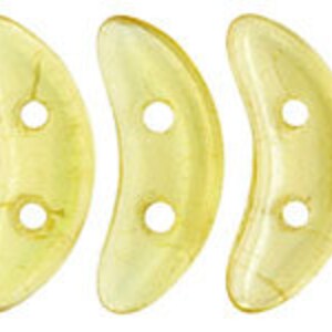 May include: Five yellow glass beads in the shape of a crescent moon with two holes each. The beads have a slightly iridescent finish.