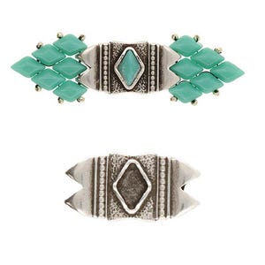 May include: A silver-toned metal clasp with a turquoise gemstone in the center. The clasp is decorated with a geometric pattern and has two rows of turquoise beads on each side.