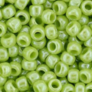 May include: A large quantity of small, round, light green plastic beads.