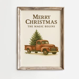 May include: A framed print with the text "Merry Christmas The Magic Begins." The image features a vintage red truck carrying a Christmas tree. The print has a rustic, farmhouse style.