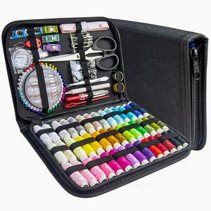 May include: Black zippered sewing kit, open to reveal a variety of colorful thread spools, needles, scissors, measuring tape, and other sewing notions. The kit is organized with elastic bands and compartments for easy access to supplies.
