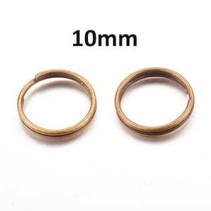 May include: Two gold-colored metal jump rings, each measuring 10mm in diameter.