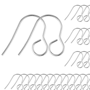 May include: A set of 50 silver-toned earring hooks. The hooks are made of metal and have a simple, classic design. They are perfect for making your own earrings.