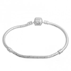 May include: A silver-colored bracelet with a snake chain design. The bracelet features a square clasp in the center and is displayed against a white background. The bracelet is a jewelry item.