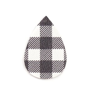 May include: Black and white buffalo plaid teardrop shaped earring with glitter.