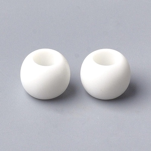 May include: Two white, spherical beads with a hole through the center. The beads are smooth and have a matte finish. They are set against a gray background. These beads are suitable for jewelry making and crafts.