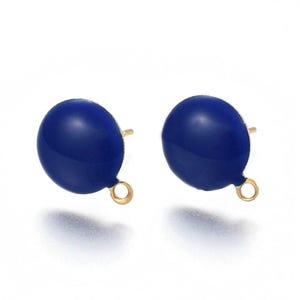 May include: A pair of blue enamel stud earrings with gold-toned posts and loops. The earrings are round and have a smooth, glossy finish.