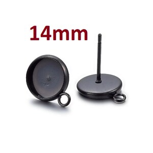 May include: Black metal earring findings with a 14mm round bezel setting. The findings have a post and a loop for attaching a charm or pendant.