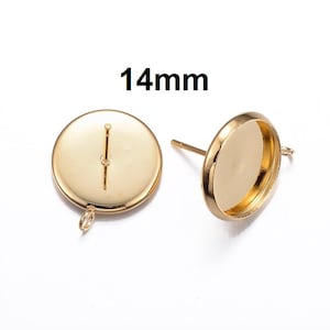 May include: Two gold-toned earring settings with a 14mm round bezel. Each setting has a post and a loop for attaching a finding.