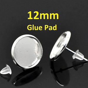 May include: Two silver 12mm glue pad earring settings with clear glass domes and rubber backs. 12mm Glue Pad