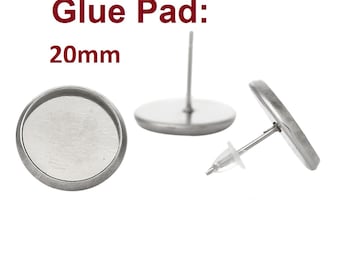 May include: Two silver earring blanks with a 20mm glue pad. The earring blanks are round and have a post with a clear rubber backing.