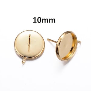 May include: Two gold-toned earring settings with a 10mm round bezel. Each setting has a post and a loop for attaching a finding.