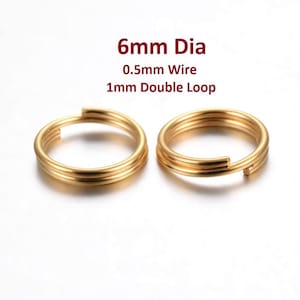 May include: Two gold-colored metal jump rings with a 6mm diameter, 0.5mm wire thickness, and a 1mm double loop.