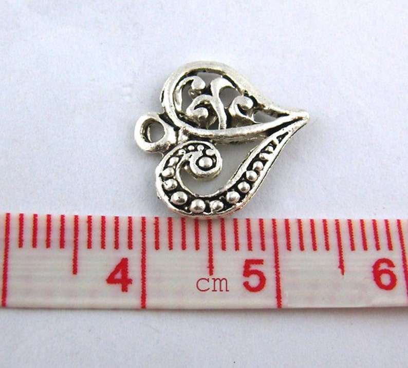 100 pcs. Silver Tone Heart Tibetan Carved Filigree Dots Charms Pendants 13mm x 14mm image 2
