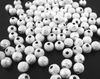 4mm - 100Stk. Versilberte Stardust Spacer Perlen