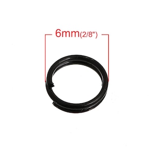 May include: A black metal key ring with a 6mm (2/8") diameter.