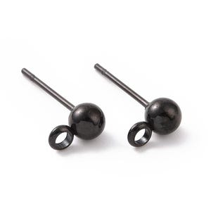 May include: A pair of black stud earrings with a small loop on the side. The earrings are made of metal and have a smooth, polished finish.