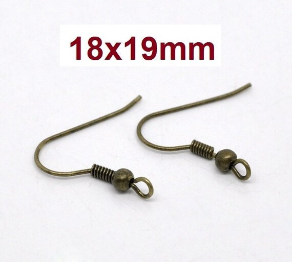 What's the purpose of the ball and spring on earrings hooks? : r