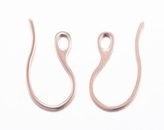 May include: Two rose gold earring hooks with a loop at the top. The hooks are made of metal and are designed to be used with earrings.