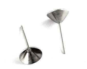May include: Two silver earring posts with a round, flat, silver base.
