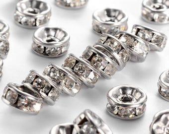 20 unidades. Cuentas espaciadoras redondas de acero inoxidable 316 transparente con diamantes de imitación - Tono plateado - 8 mm x 4 mm - Tamaño del orificio: 2 mm - Bordes rectos