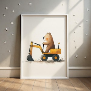 May include: A framed watercolour print featuring a brown bear operating a yellow excavator. The bear is in the driver's seat, with the excavator digging. The artwork is set against a neutral background, with a white frame.