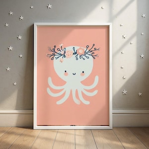 May include: A framed art print featuring a whimsical octopus illustration. The octopus is white with a floral crown and smiling face, set against a soft coral background. The print is in a white frame, perfect for a nursery or children's room.