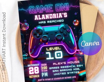 以下が含まれることがあります： ネオン風のゲームコントローラーのデザインが施された鮮やかな招待状。「GAME ON! ALANDRIA'S HAS REACHED LEVEL 10」と書かれています。イベントの詳細（日付、時間、場所、RSVP情報）が含まれています。デザインは、黒い背景にネオンブルー、紫、オレンジのアクセントが施されています。