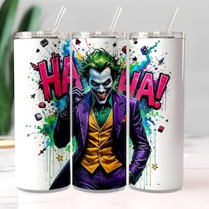 May include: Three white stainless steel tumblers with straws. Each tumbler features a colorful graphic of the Joker with the word "HA HA!" in bold letters. The Joker is depicted in a purple suit, green hair, and white face paint.