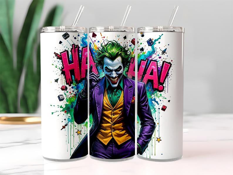 May include: Three white stainless steel tumblers with straws. Each tumbler features a colorful graphic of the Joker with the word "HA HA!" in bold letters. The Joker is depicted in a purple suit, green hair, and white face paint.