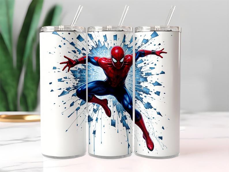 May include: Three white stainless steel tumblers with a Spider-Man graphic. The superhero is depicted in a dynamic pose, wearing his signature red and blue suit, against a blue and white burst background. Each tumbler has a silver lid and a clear straw.