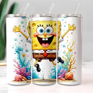 May include: Three white stainless steel tumblers with clear straws. Each tumbler features a vibrant cartoon illustration of SpongeBob SquarePants, surrounded by colorful coral, bubbles, and starfish. The design is set against a white background.