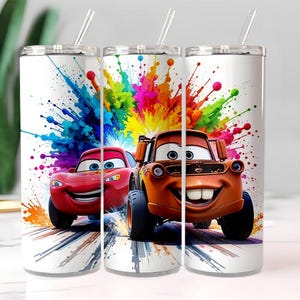 May include: Three white stainless steel tumblers with a colorful design featuring the characters Lightning McQueen and Mater from the movie Cars. Each tumbler has a straw and a vibrant splash of paint.