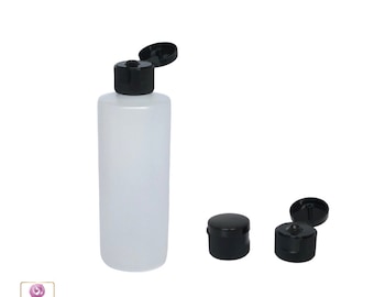 May include: A white plastic bottle with a black flip top cap. The bottle is empty and ready to be filled with liquid. The cap is open and the bottle is sitting on a white background.