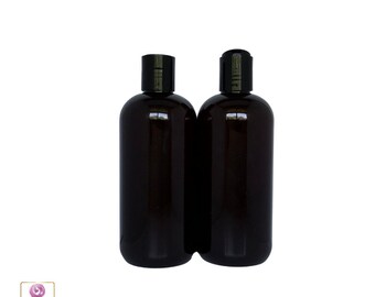 May include: Two amber glass bottles with black pump tops. The bottles are empty and ready to be filled with your favorite liquid.