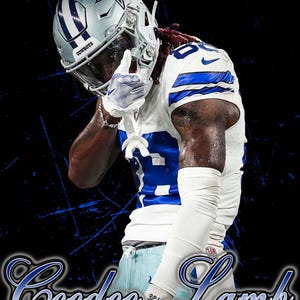 May include: A football player in a Dallas Cowboys uniform, featuring a silver helmet with a star logo and the word "Cowboys." The jersey is white with blue accents and the number 88. The name "CeeDee Lamb" is displayed in a stylized font.