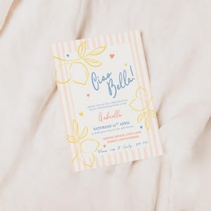 An elegant and fun bachelorette party invitation with a pink stripe background and yellow, salmon and blue brush and bold style text. Featuring lemons and hearts illustrations.