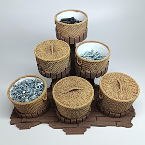 May include: A tiered display stand with six woven baskets. The baskets are filled with various hardware items, including nuts, bolts, and screws. The stand is made of brown wood and has a rustic appearance. The baskets have a light brown color.
