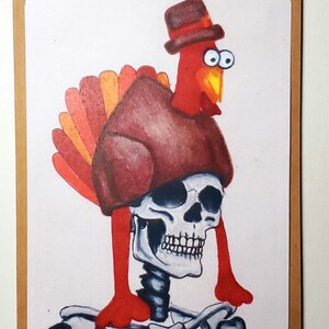 May include: A humorous illustration of a turkey wearing a hat and a shirt, with a skeleton body. The turkey is red with a yellow beak and orange and red tail feathers. The image is on a white background with a brown border.