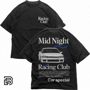 May include: Black t-shirt with "Racing Club" printed on the front. The back features a white car graphic with "Mid Night Racing Club" and text about the club. The shirt is a car special.