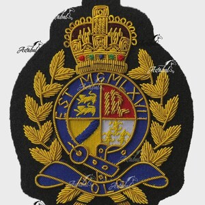 May include: A black embroidered patch featuring a gold crown at the top, a central circular crest with the Roman numerals MCMLXIII, and gold laurel leaves on the sides. The crest is divided into four quadrants with lions, a red field, and fleur-de-lis.