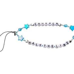 Enhyphen&#39;s &#39;Walk The Line&#39; Tour Essentials: Lightstick/Phone Charm