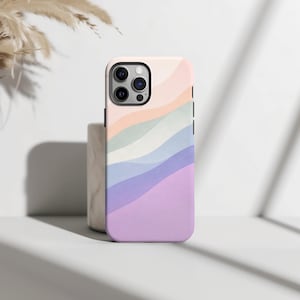 May include: A smartphone case featuring a smooth, wavy pattern of soft pastel colors including peach, sage green, light blue, and lavender. The design covers the back of the case, which has a cutout for a triple-lens camera system on the top left.
