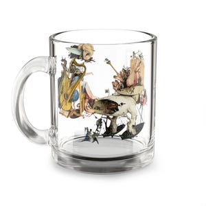 May include: Clear glass coffee mug featuring a surrealist artwork print. The artwork depicts a fantastical scene with figures, musical instruments, and architectural elements in muted tones. The mug has a clear handle and a simple, cylindrical shape.