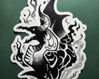 May include: Black and white sticker featuring a stylized illustration of a creature with a bird-like head, horns, and a fish-like body. The design includes smoke-like elements and dot shading, creating a detailed and artistic aesthetic. The sticker is on a green background.