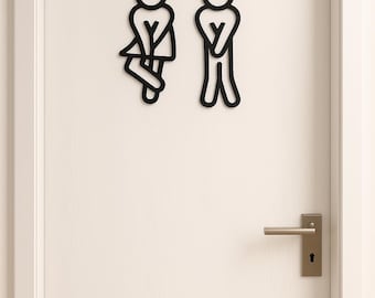 Puede incluir: Señales de baño negras en una puerta blanca. Los letreros representan figuras masculinas y femeninas estilizadas. La puerta tiene un tirador plateado y una cerradura. La puerta está enmarcada en un marco blanco.